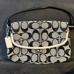 Coach Y2K vintage Signature Canvas Fold Over Frame Bag with a kisslock closure